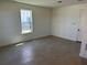 Well-lit bedroom with tile floors, light walls, and a window providing ample natural light at 15088 Grove Lake Dr, Winter Garden, FL 34787