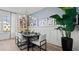 Inviting dining room with stylish table setting, modern chandelier, and decorative wall art at 15113 Grove Lake Dr, Winter Garden, FL 34787