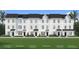 Charming townhome exteriors showcasing optional porches, lush lawns, and inviting front entrances at 15113 Grove Lake Dr, Winter Garden, FL 34787