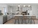 Contemporary kitchen featuring stainless steel appliances and a central island with bar-style seating at 15113 Grove Lake Dr, Winter Garden, FL 34787