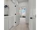Convenient laundry area located off of bedroom featuring modern white appliances and neutral decor at 15113 Grove Lake Dr, Winter Garden, FL 34787