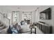 Bright and airy living room with contemporary furnishings and large windows at 15113 Grove Lake Dr, Winter Garden, FL 34787