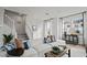 Comfortable living room with a neutral color palette, plush sofa and staircase access at 15113 Grove Lake Dr, Winter Garden, FL 34787