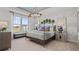 Tranquil main bedroom features a chandelier, large windows, and scenic views at 15113 Grove Lake Dr, Winter Garden, FL 34787