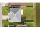 Aerial view of the house featuring a large manicured lawn, privacy fence, and a pond at 3189 Kearns Rd, Mulberry, FL 33860