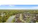 Scenic aerial view of a residential neighborhood, with a canal and lush greenery at 3189 Kearns Rd, Mulberry, FL 33860