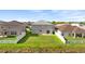 Back exterior view of a home with a well-maintained lawn and privacy fencing at 3189 Kearns Rd, Mulberry, FL 33860