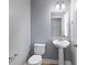 Bathroom with pedestal sink, mirror, toilet and neutral paint at 3189 Kearns Rd, Mulberry, FL 33860