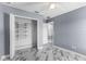 Bedroom featuring a closet, ceiling fan, grey walls, and tile floor at 3189 Kearns Rd, Mulberry, FL 33860