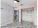 Bedroom featuring a large walk-in closet and grey marble flooring at 3189 Kearns Rd, Mulberry, FL 33860