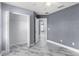 Spacious bedroom with tile floors, and walk-in closet at 3189 Kearns Rd, Mulberry, FL 33860