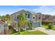 Two-story home with a palm tree, a two-car garage and views of a pond at 3189 Kearns Rd, Mulberry, FL 33860