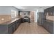 Stylish kitchen with stainless steel appliances, cabinetry, and tile flooring at 3189 Kearns Rd, Mulberry, FL 33860