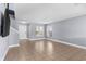 Bright living room with tile flooring, white door and windows that provide lots of natural light at 3189 Kearns Rd, Mulberry, FL 33860