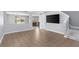 Open-concept living room leading to the kitchen and staircase at 3189 Kearns Rd, Mulberry, FL 33860