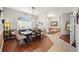 Elegant dining room featuring hardwood floors, stylish chairs and a modern chandelier above the dining table at 119 Lake Mariam Way, Winter Haven, FL 33884