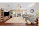 Cozy living room featuring a fireplace, hardwood floors, neutral decor, and ample natural light at 119 Lake Mariam Way, Winter Haven, FL 33884