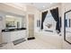 Light and bright main bathroom with soaking tub, shower and vanity at 119 Lake Mariam Way, Winter Haven, FL 33884