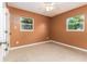 Bedroom featuring tile floors and neutral walls at 824 Interlake Dr, Lakeland, FL 33801