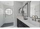 Modern bathroom with a glass-enclosed shower, double vanity, and stylish finishes, creating a spa-like retreat at 5012 Laguna Bay Cir # 72, Kissimmee, FL 34746