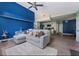 Bright living room with a blue accent wall, modern furniture, and stylish decor, creating a cozy and inviting space at 5012 Laguna Bay Cir # 72, Kissimmee, FL 34746