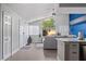 Open-concept space with large windows, modern sofa, and kitchen bar, perfect for entertaining and relaxation at 5012 Laguna Bay Cir # 72, Kissimmee, FL 34746