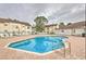 Inviting community pool with lounge chairs, perfect for relaxing and enjoying sunny days at 5012 Laguna Bay Cir # 72, Kissimmee, FL 34746