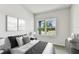 Calm bedroom featuring a large window with outside views for a serene setting at 6057 Sacred Oak Ave, Mount Dora, FL 32757