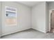 Bedroom with neutral colored carpet, and window at 6057 Sacred Oak Ave, Mount Dora, FL 32757
