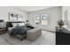 Cozy bedroom with neutral tones, two bright windows, and ample natural light at 6057 Sacred Oak Ave, Mount Dora, FL 32757