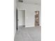 Bedroom with open doors to closet and bathroom at 6057 Sacred Oak Ave, Mount Dora, FL 32757