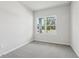 Bright bedroom featuring one window and neutral carpet at 6057 Sacred Oak Ave, Mount Dora, FL 32757