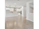 Spacious kitchen with an island and stainless steel appliances opens to the living area at 6057 Sacred Oak Ave, Mount Dora, FL 32757