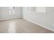 Bright living space showing neutral paint, base trim, and tile flooring at 6057 Sacred Oak Ave, Mount Dora, FL 32757