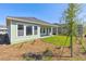 Backyard featuring the home's covered patio, green grass, and simple landscaping at 6221 Trailblaze Bnd, St Cloud, FL 34771