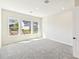 Bedroom with carpet and large windows at 6221 Trailblaze Bnd, St Cloud, FL 34771