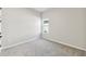 Cozy bedroom with neutral carpet, a window for natural light, and fresh, neutral paint at 6221 Trailblaze Bnd, St Cloud, FL 34771