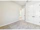 Bedroom featuring carpet, a closet with double doors, and neutral paint at 6221 Trailblaze Bnd, St Cloud, FL 34771