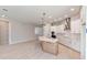 Bright kitchen with large island, stainless hood, recessed lights, and eating area at 6221 Trailblaze Bnd, St Cloud, FL 34771
