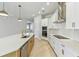 Bright kitchen with white cabinets, stainless steel appliances, and a large center island at 6221 Trailblaze Bnd, St Cloud, FL 34771