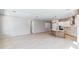 Open floor plan with a kitchen featuring a large island and stainless steel appliances at 6221 Trailblaze Bnd, St Cloud, FL 34771