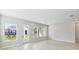 Sun-filled living room with direct backyard access and multiple windows at 6221 Trailblaze Bnd, St Cloud, FL 34771