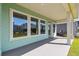 Welcoming covered patio featuring a view of the yard and neighborhood at 6221 Trailblaze Bnd, St Cloud, FL 34771