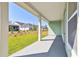 Relaxing covered patio with view of the backyard and neighborhood at 6221 Trailblaze Bnd, St Cloud, FL 34771