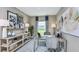 Home office featuring an area rug, shelves, desk and chair with natural light at 7347 Capstone Dr, Groveland, FL 34736