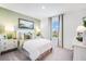Cozy bedroom with ample natural light, complemented by soft hues and comfortable furnishings at 7396 Capstone Dr, Groveland, FL 34736