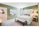 Spacious bedroom offers natural light, cozy rug, and a relaxing atmosphere at 7396 Capstone Dr, Groveland, FL 34736