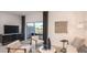 Bright living room with backyard views, comfortable seating, and modern decor at 7605 Waterscape Dr, Groveland, FL 34736
