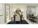Bright dining area features modern decor, stylish lighting, and a sliding glass door at 958 Hour Glass Rd, Lakeland, FL 33801