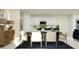 Open dining area showcases a modern table, contemporary decor, and an elegant area rug at 958 Hour Glass Rd, Lakeland, FL 33801